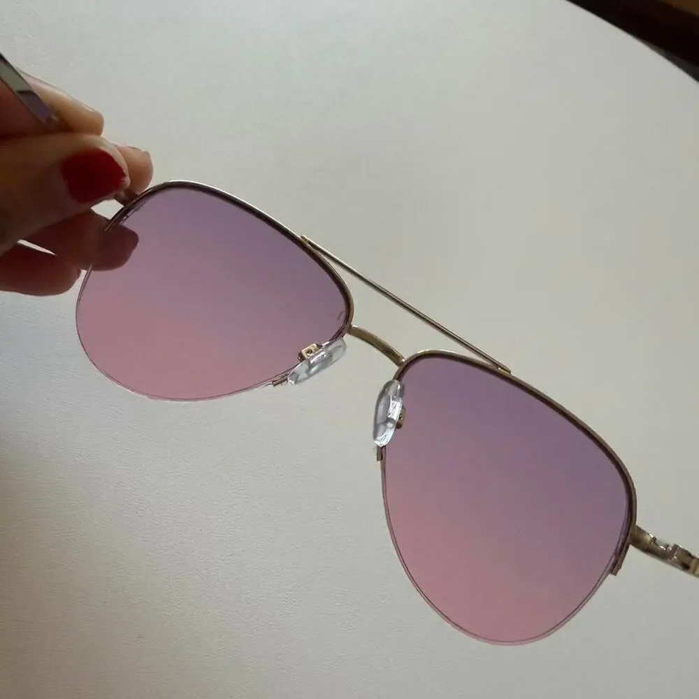 Gold aviator sunglasses with purple